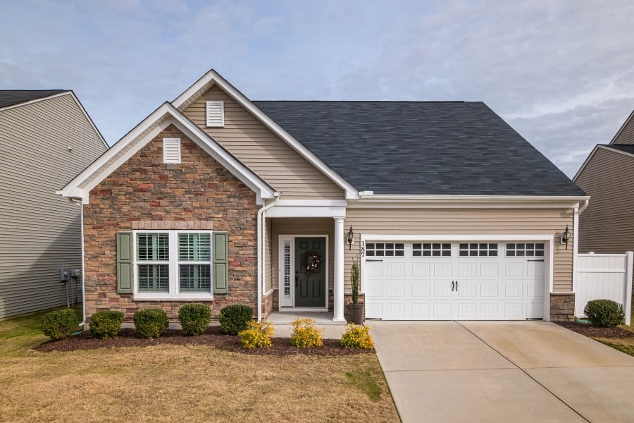 house exterior front with concrete driveway